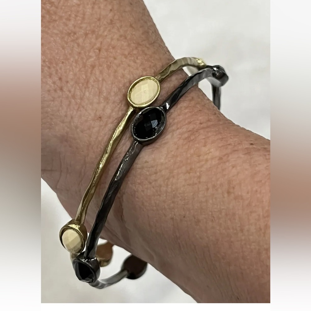 Set of 2 bangle bracelets gold tone with ivory and gun metal with black stones